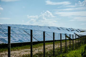 Fototapeta premium photovoltaic solar panels, alternative energy concept. solar energy panels on the field.