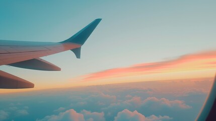 Fototapeta premium Flying High: Airliner Wing Amidst Sunset Clouds