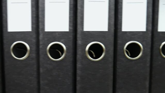Close-up of many black archive folders