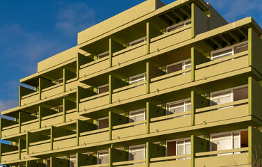 Facade with balconies of a hotel in a tourist area of the island of Mallorca at sunset. Spain