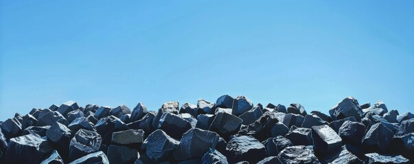 Pile of large rocks under clear blue sky. Tranquil and serene nature concept
