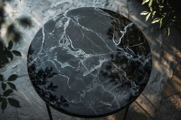 Aerial view of round black marble table