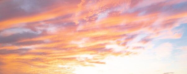 Sunset or sunrise. Dramatic majestic scenery sunset. Sky with clouds in sunset sky light...