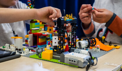 Naklejka premium Tallinn, Estonia - May 5, 2024: Moving Lego robot built by kids. At First Lego League children build robots and solve robotics challenges.
