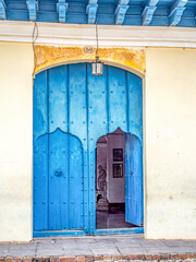 Colorful buildings and interesting doorways  found in small town in rural Cuba.
