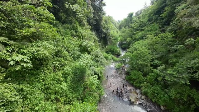 flying an fpv drone on a river and waterfall