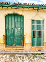 Colorful buildings and interesting doorways  found in small town in rural Cuba.