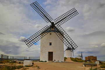 Old windmills in top of the hill in Consuegra Village. Land of the Giants and Don Quixote stories.