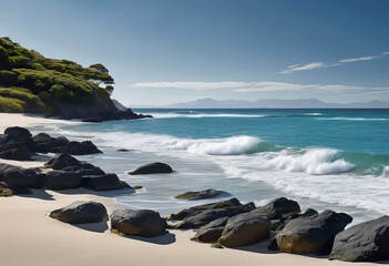 Obraz premium A serene sandy beach located at the water's edge, overlooking the calm sea.