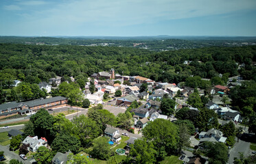 aerial view of the town of highland new york hudson valley next to poughkeepsie ulster county (church downtown historic commercial district with homes and distant mountains)