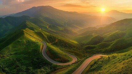 Rolling mountain highway snaking through verdant hills under a radiant golden sunrise.