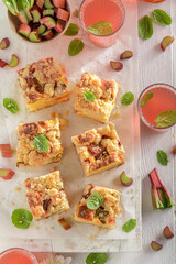 Fresh and tasty rhubarb yeast cake with sugar and crumble.