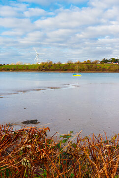 landscape with Windmill, boat, lake and clouds