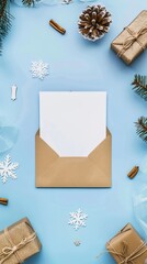 Letter to Santa Claus mockup. Flat lay blank paper card, craft envelope, gift box, wooden decorations on blue background. Top view. Christmas letter concept 