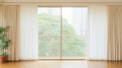 Sunny Room with Urban View.  Bright, airy room with large window overlooking green trees in an urban setting, white curtains, and a potted plant