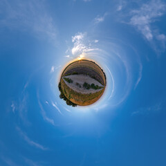 simple tiny planet without buildings in blue sky with beautiful clouds. Transformation of spherical...