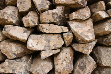 Natural background image of a close-up of a messy rock wall