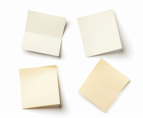 a group of four sticky notes sitting on top of a white surface