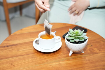 woman hands holding a cup