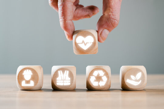 Health, Safety, and Environment (HSE) Concept with Wooden Blocks Featuring Safety, Health, Recycling, and Sustainability Icons