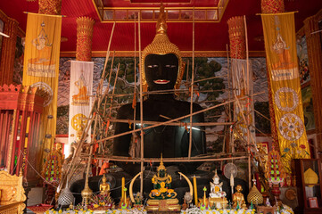 The big Buddha statue named Phra Chao Takhiao during repair situated in Wat Ban Lao Phra Chao Takhiao temple. This is one of a sacred Buddha image in Lamphun.