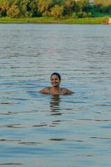 girl swimming in amazon river