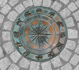 decorative compass on the cement ground