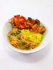 Indonesian Feast in a Cup: Nasi Kuning with Chicken, Egg, and Fragrant Rice on a White Background