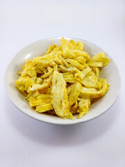 Delicate Yellow Omelette Slices Presented in a White Cup on a Pure White Background
