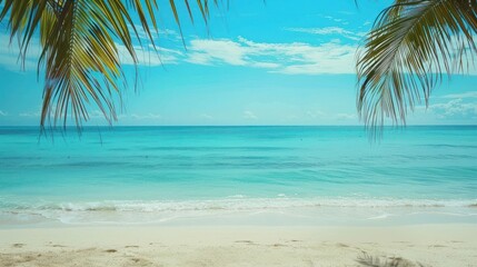 Obraz premium Beach Bliss: A pristine sandy beach with crystal-clear turquoise waters stretching to the horizon, framed by palm trees. Ample space in the sky for text overlay. 