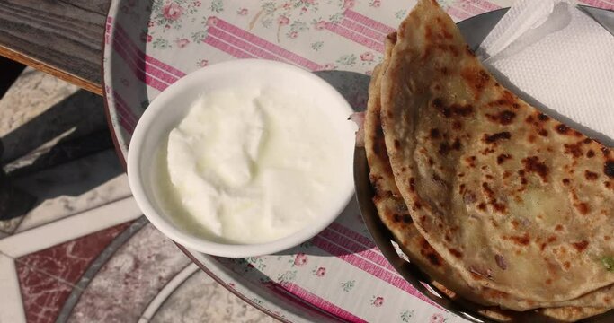 Popular Indian food Aloo Paratha with yogurt and pickles aloo paratha with curd