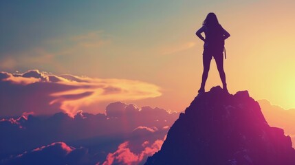 womans silhouette gracefully posed on a mountain peak at sunset, capturing the essence success ambition