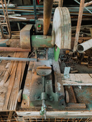 Close-up of vintage metal cutting machine in workshop.