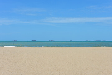 Beach waves of the sea on the sandy beach season Summer on top view background .
