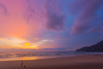 Obraz premium Scenery sweet sky cloud scape in colorful sunset..colorful light through to the cloud above the ocean..Scene of Colorful romantic sky sunset background..An ocean sunset with a sweet sky
