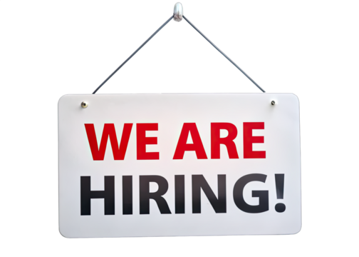 A white hanging sign with red and black text reads We Are Hiring! against a white background. Generative AI