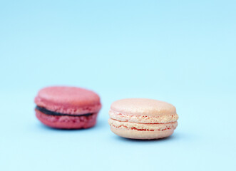 Baked dessert, candy and display of french sweets with variety, delicacy and treats on blue background. Cookies, macaroons and different flavors of confectionery for bakery, fine dining and luxury