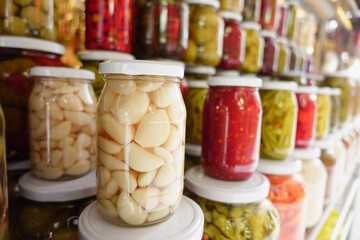 Canned fruits and vegetables in glass jars