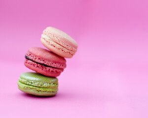 Macaroons, cake and stack of French sweets with variety, delicacy and treats on pink background. Baked dessert, luxury or different flavors of candy for bakery, fine dining and cookies with copyspace