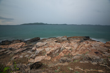 Orange rocky shores and smooth seas