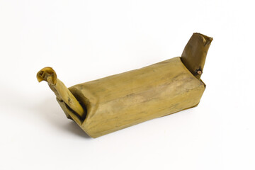 Lontong is an Indonesian dish. Rice is rolled inside a banana leaf and boiled, Indonesian Rice Cake Wrapped with Banana Leaf. Indonesian traditional food