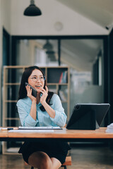 Asian woman working at the office. woman using laptop computer on desk at office