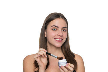 Fototapeta premium Woman do makeup with brush applying blush beauty cosmetic product. powder isolated on white