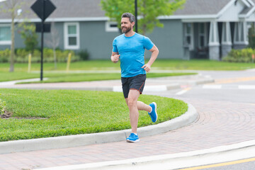 Healthy lifestyle with daily fitness. Fitness and sport. Man running with energy. Sport lifestyle. Sportsman running in the morning. Sport man training outdoor in neighborhood. Physical fitness