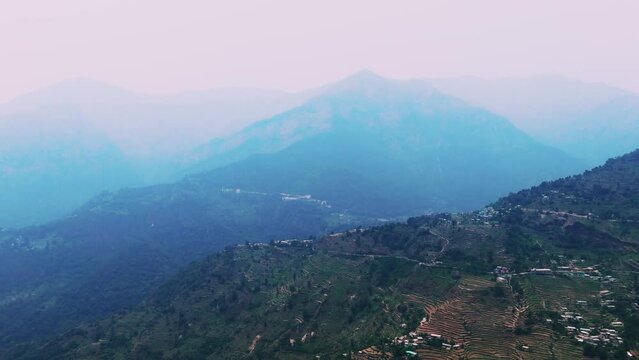 Sagar Village is Chamoli district of Uttarakhand Base of Rudranath Trek aerial view of foggy mountains valley and sky landscape drone shot
