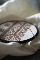 Brown Embroidery Stitch Detail on White Fabric. Traditional Ukrainian embroidery