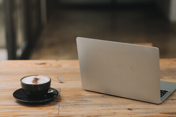 Closeup of coffee cup on table in empty corporate conference room before business meeting in office