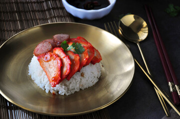 A Dish of Cantonese Style BBQ Pork with Rice put on Bamboo Mat