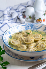 Dumplings with meat in a spicy broth.