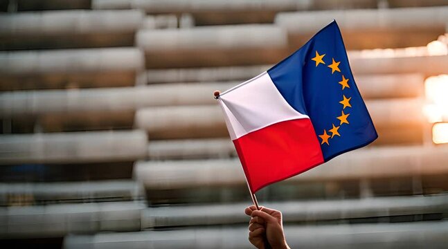Flaga Polski i Unii trzymana w dłoni